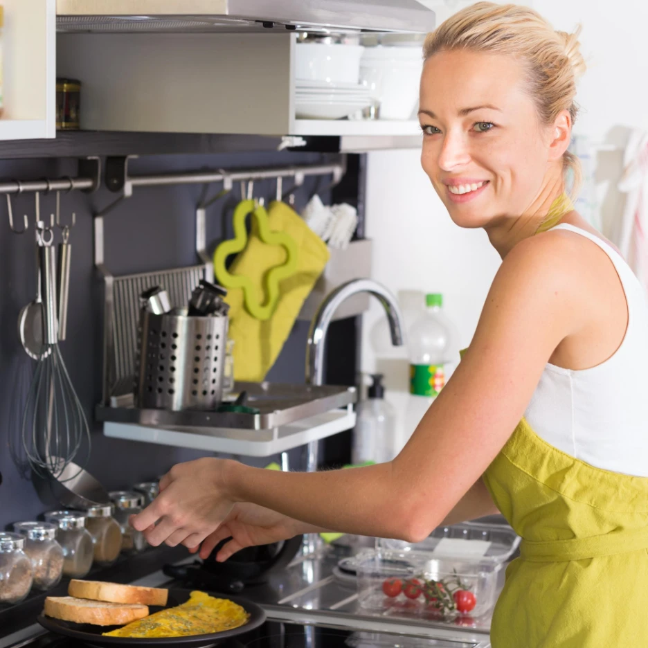 portrait mid adult woman cleaning kitchen