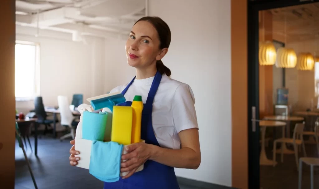 a cleaning lady holding basket with detergent on it
